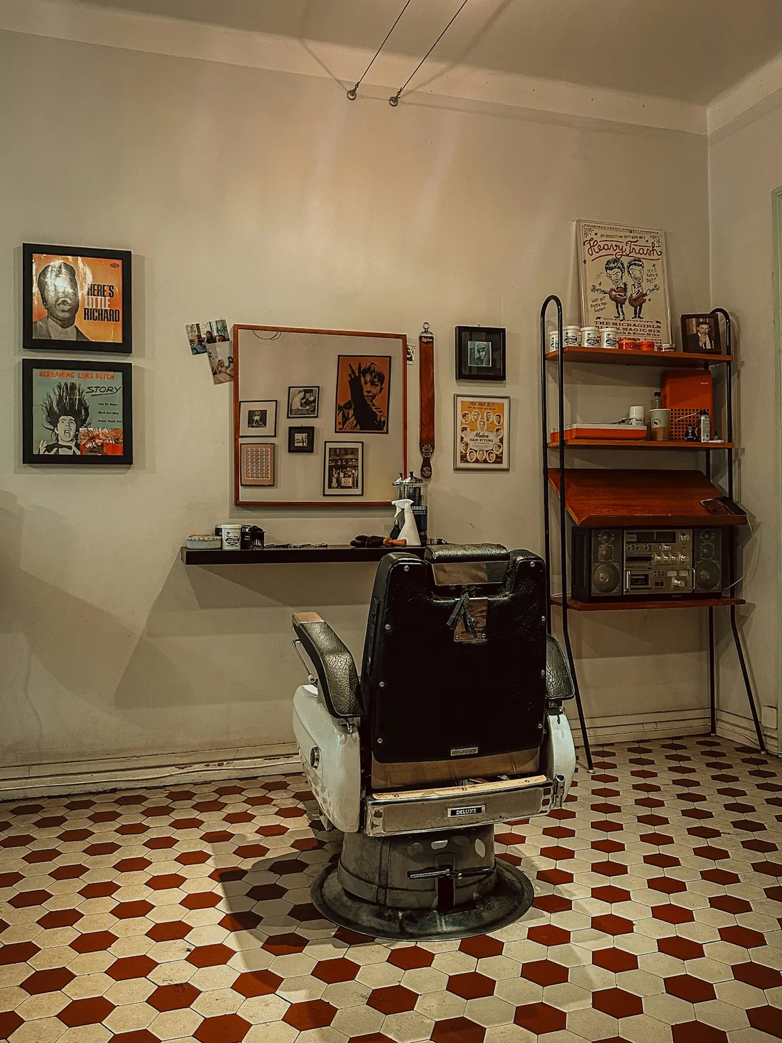 Framed prints, clippers and product above the back counter