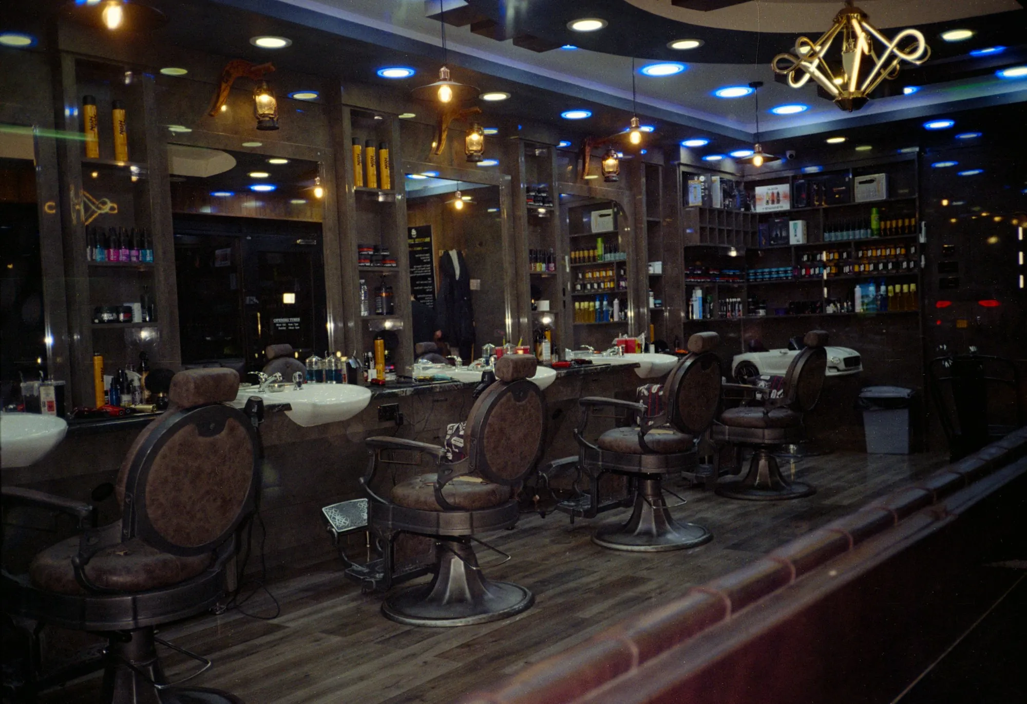 The full length of the shop floor at night