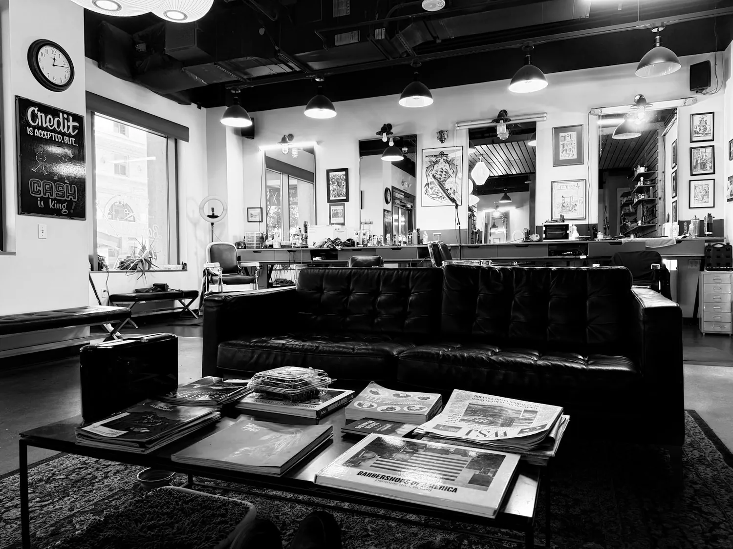 Black and white view down the length of the shop